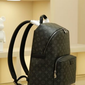 Alternative view of This Apollo backpack, crafted from supple Monogram Eclipse coated canvas, perfectly blends style and functionality. It features a range of distinctive design details, including exceptionally comfortable leather shoulder straps and a front pocket with magnetic closure.40×30×20cm (L×H×W) Outer: Monogram Eclipse coated canvas Lining: Fabric Trim: Natural cowhide leather Hardware: Silver-plated metal Features: 1 pair of adjustable leather shoulder straps, top handle, 2 interior patch pockets, 1 iPad pocket, zipper closure, front zipper compartment, magnetic closure exterior pocket.